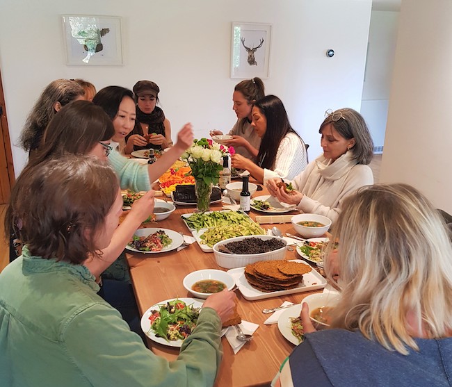 A contemplative moment as students enjoy the lunch they have created at the Healing Diets Immersion at School of Natural Medicine UK